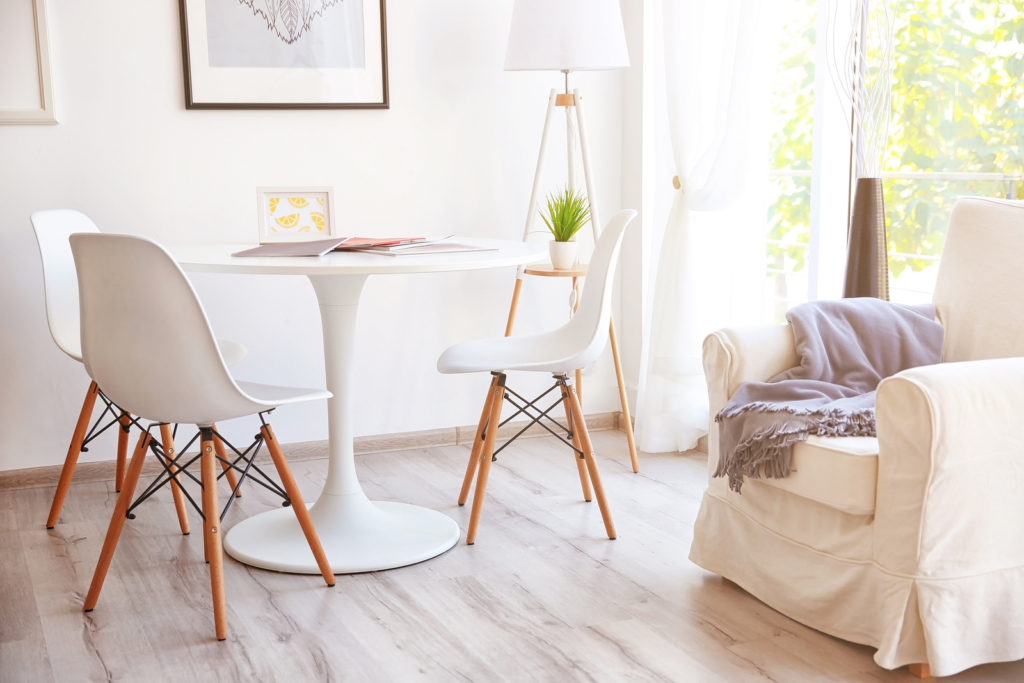 Bright, inviting dining area with cozy seating, ideal for creating a welcoming Airbnb experience.